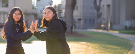 Photo of Two Latina Girls Clapping hands