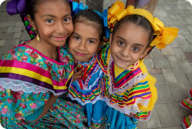 Photo three young Latina Girls in traditional dress