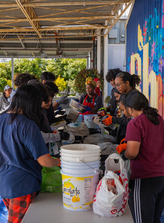 Photo of people in line outside volunteering